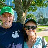 Paul Buth '78 and Kristine Buth hug as they pose for picture